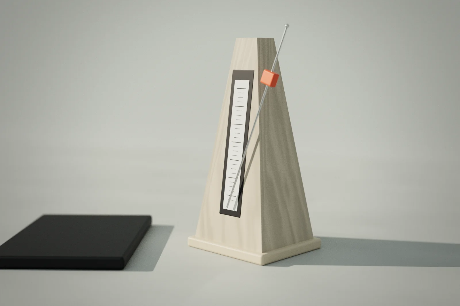 A pale wooden metronome on a light desk with its pendulum mid-swing; the sliding weight on the pendulum is ember-coloured.